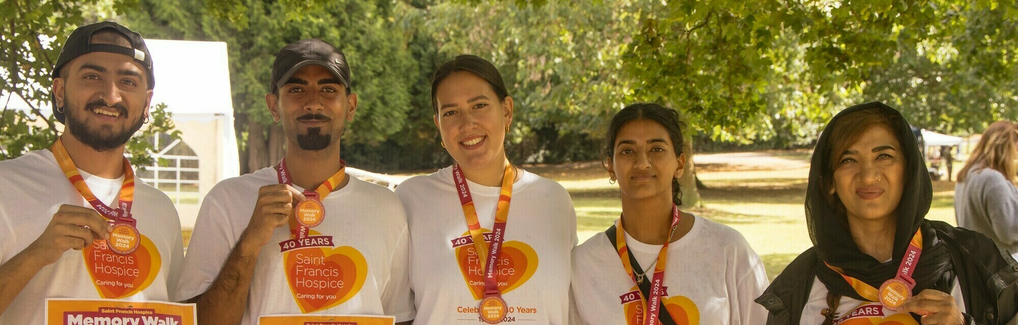 Robina and her family with their medals (cropped)