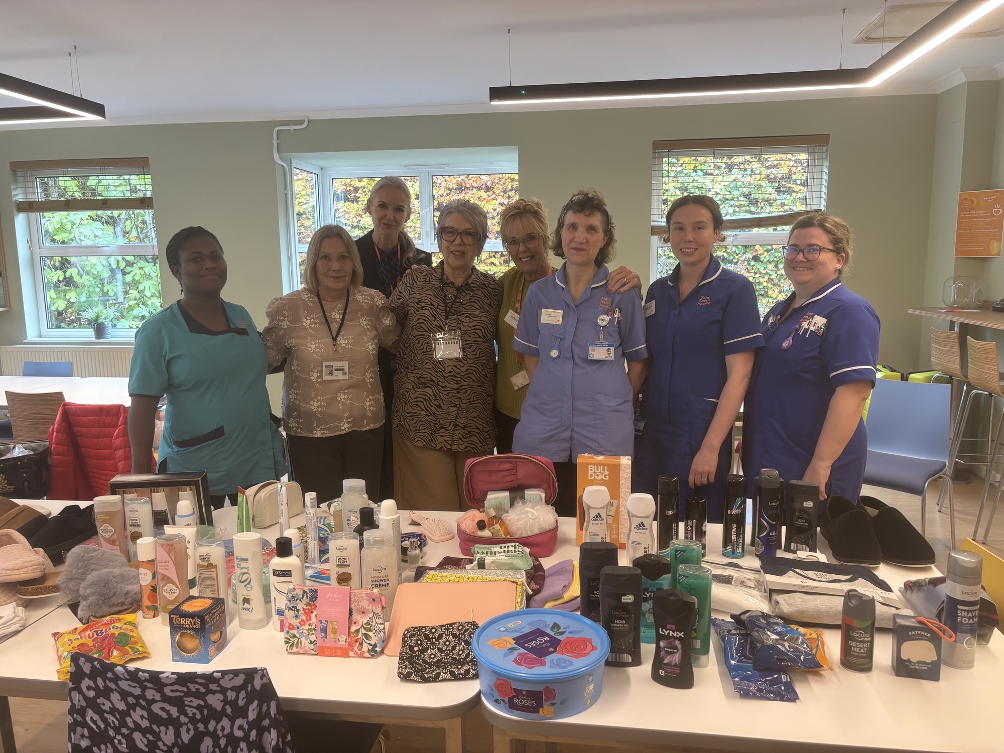 Ivy Pound and her friend Pat with staff at Saint Francis Hospice