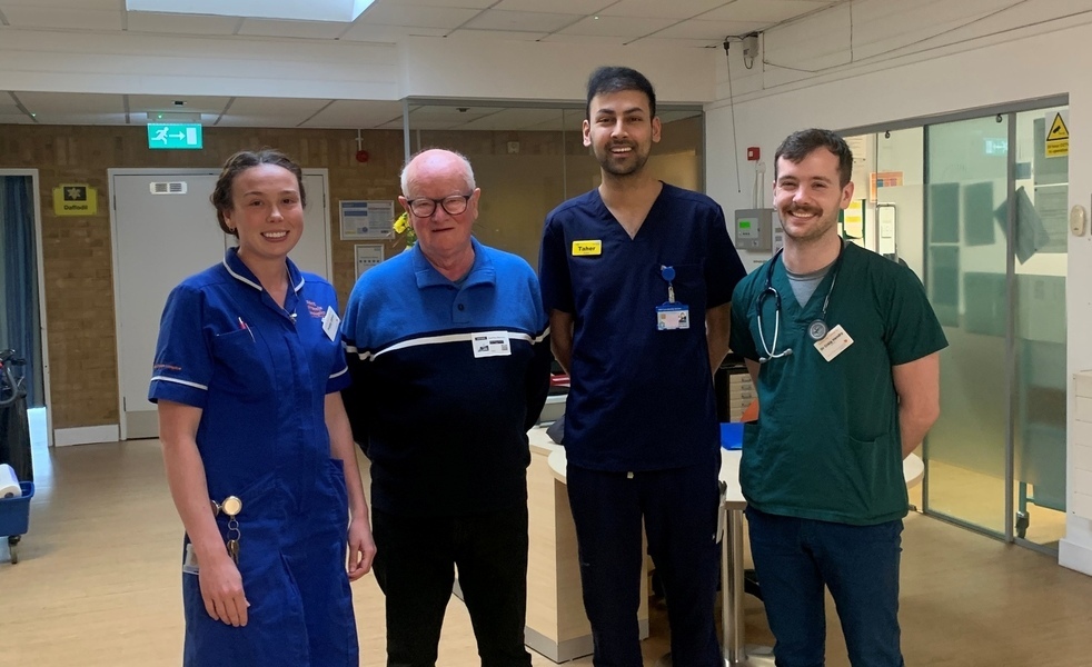 Geoff Marchant with members of the hospice care team on the ward (cropped)